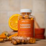 Vibrant display of Jellybee Turmeric & Ginger gummies with fresh ingredients.