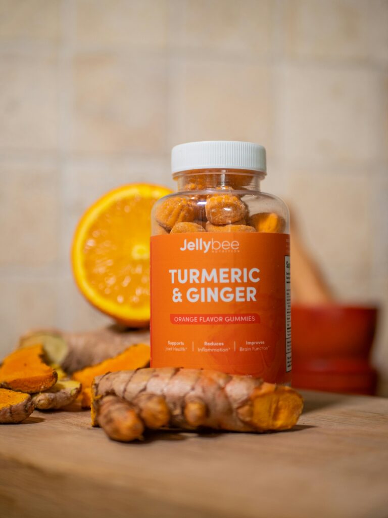 Vibrant display of Jellybee Turmeric & Ginger gummies with fresh ingredients.